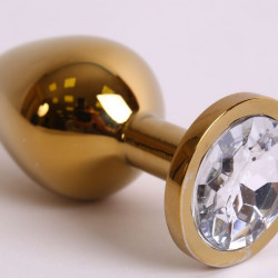 Большая золотистая анальная пробка с прозрачным кристаллом - 9,5 см.